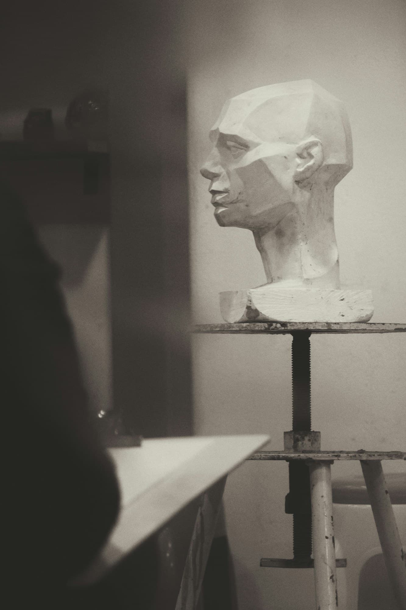 A plaster bust in soft studio light.